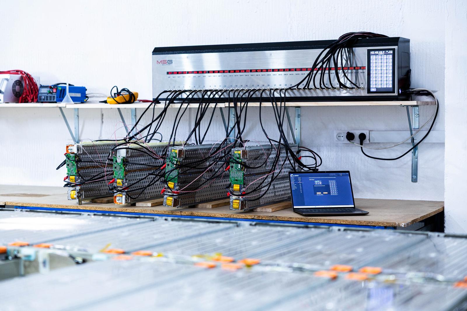 Professional EV battery cell repair with protective equipment at Avolto